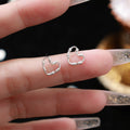 S999 Sterling Silver Commuter Hollow Heart Ear Studs Female Special-interest Design - Norellé